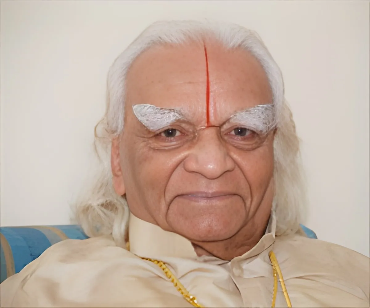 Portrait of Yogacharya B.K.S. Iyengar, Guruji, smiling, with white hair and a red tilak